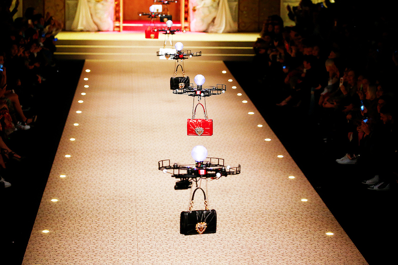 Drones carry bags, the creations from the Dolce & Gabbana Autumn/Winter 2018 women's collection during Milan Fashion Week in Milan, Italy February 25, 2018. REUTERS/Tony Gentile