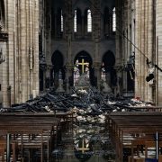 Fire damaged wood and stone sits near the altar inside Notre Dame Cathedral in Paris, France, on Tuesday, April 16, 2019. Authorities declared Tuesday morning that the blaze had been contained as firefighters hosed the south side of the transept to cool down the building, and a district around the cathedral was sealed as military and police patrolled the area. Photographer: Christophe Morin/Bloomberg