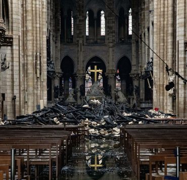 Fire damaged wood and stone sits near the altar inside Notre Dame Cathedral in Paris, France, on Tuesday, April 16, 2019. Authorities declared Tuesday morning that the blaze had been contained as firefighters hosed the south side of the transept to cool down the building, and a district around the cathedral was sealed as military and police patrolled the area. Photographer: Christophe Morin/Bloomberg