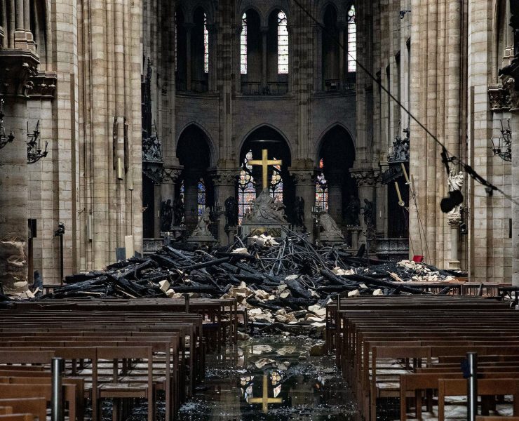 Fire damaged wood and stone sits near the altar inside Notre Dame Cathedral in Paris, France, on Tuesday, April 16, 2019. Authorities declared Tuesday morning that the blaze had been contained as firefighters hosed the south side of the transept to cool down the building, and a district around the cathedral was sealed as military and police patrolled the area. Photographer: Christophe Morin/Bloomberg